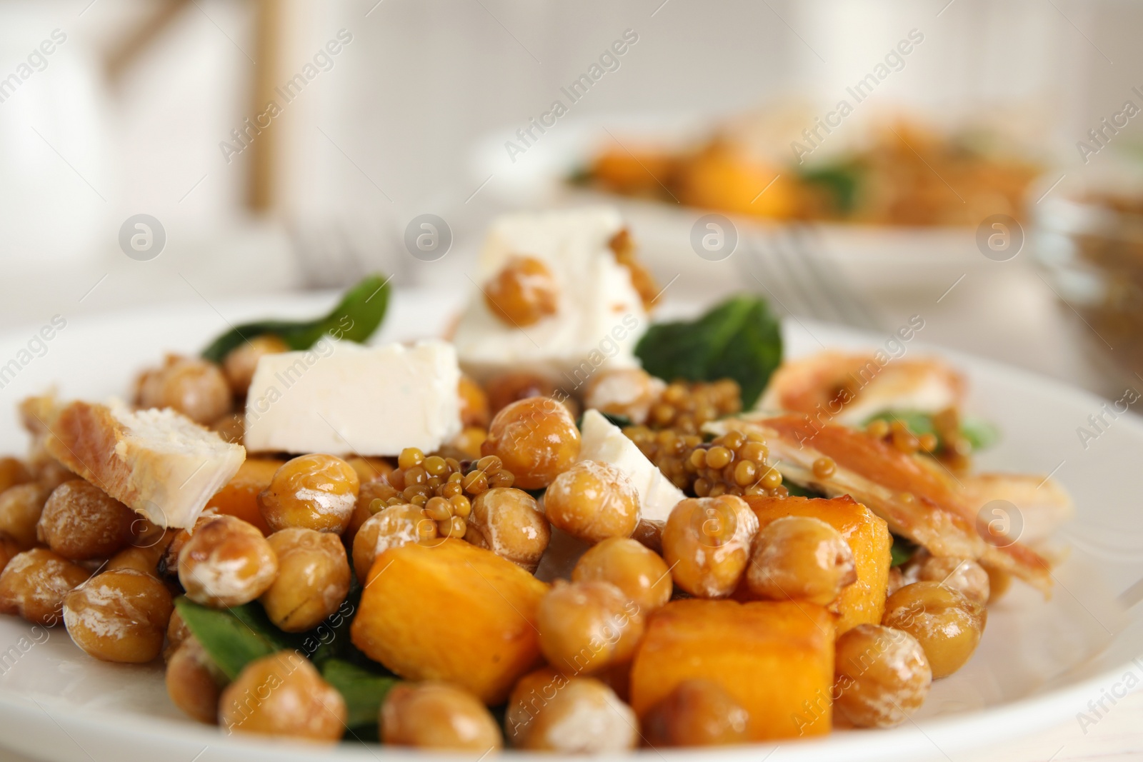 Photo of Delicious fresh chickpea salad on plate, closeup
