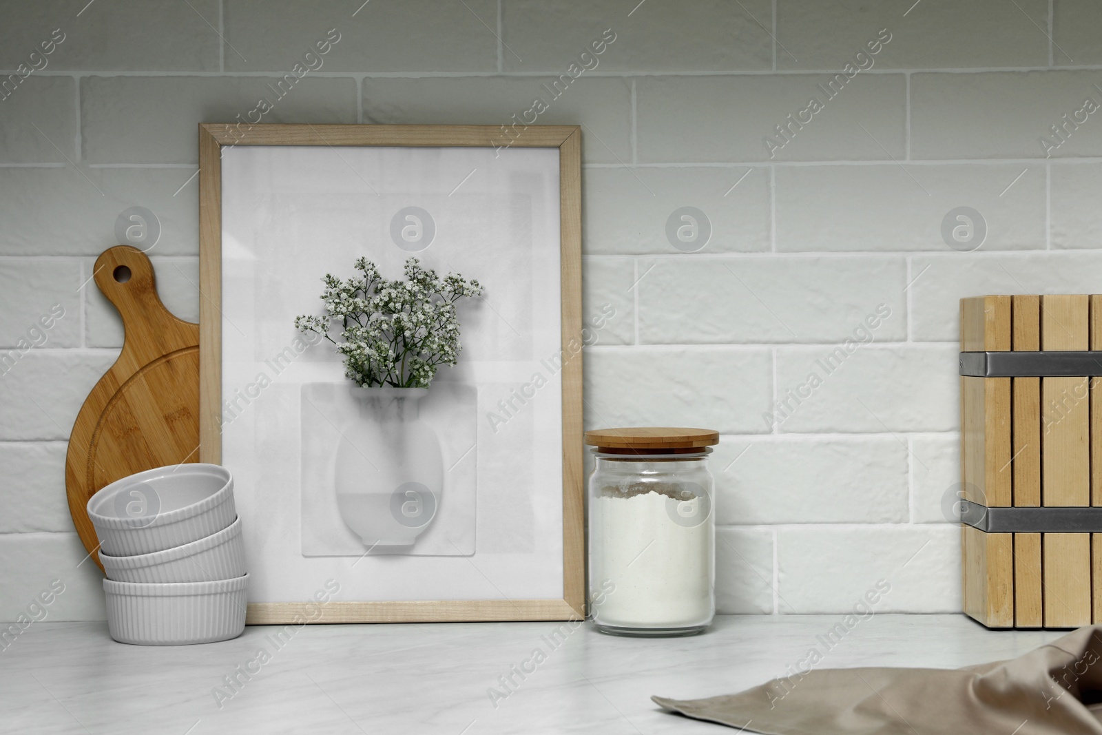 Photo of Silicone vase with flowers on countertop in kitchen