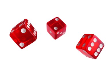 Three red dice in air on white background