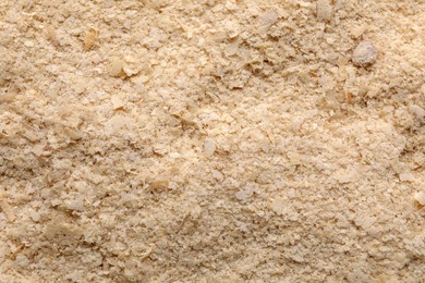 Brewer`s yeast flakes as background, closeup view