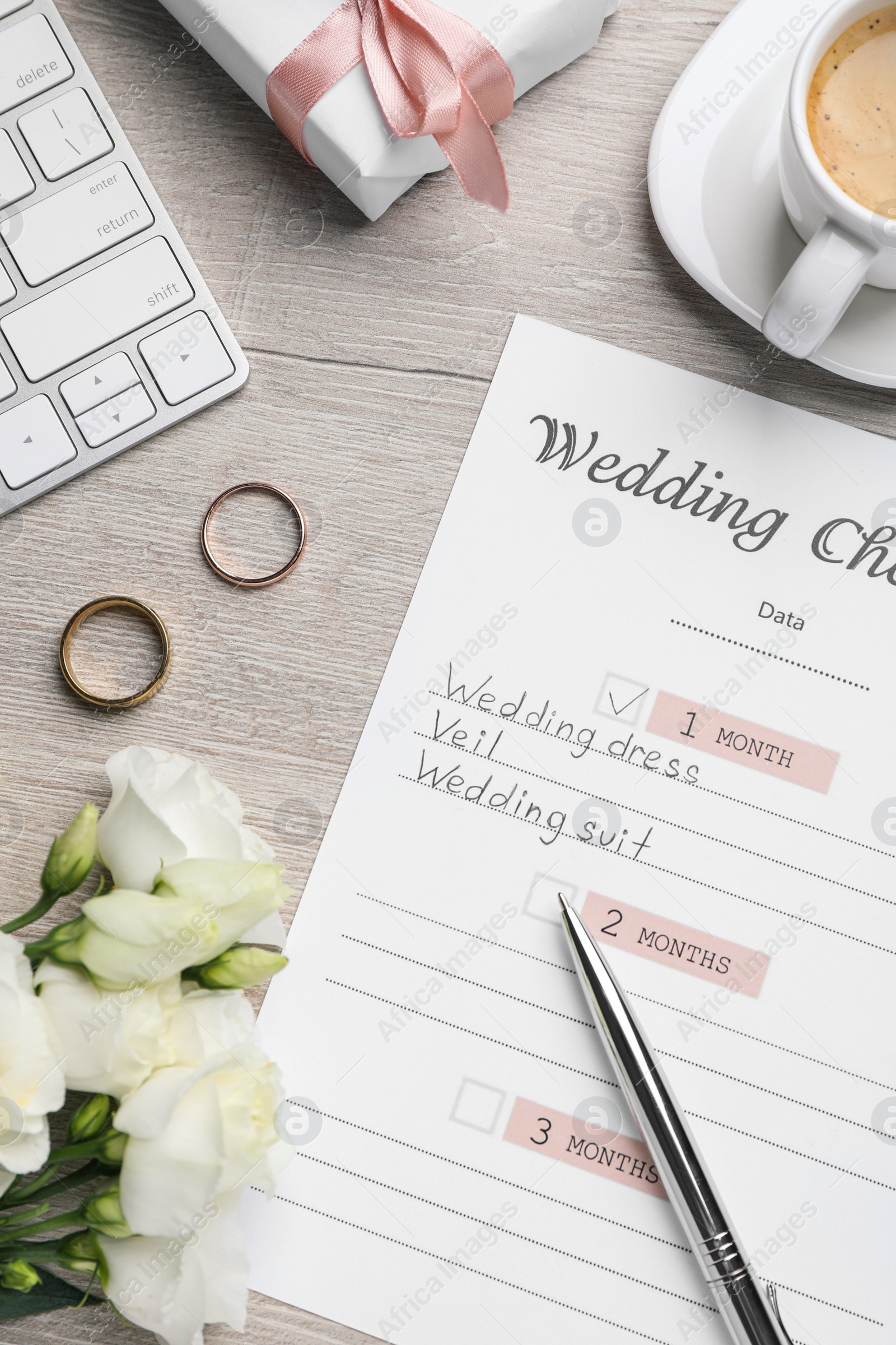 Photo of Flat lay composition with Wedding Checklist on wooden table