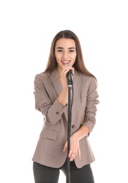 Young stylish woman in jacket with microphone on white background