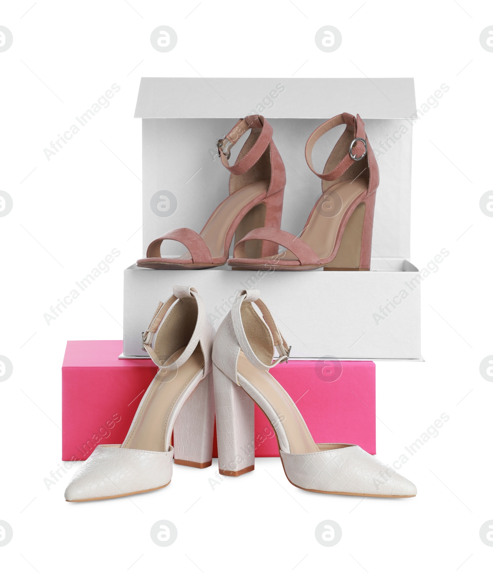 Photo of Stylish shoes and boxes on white background