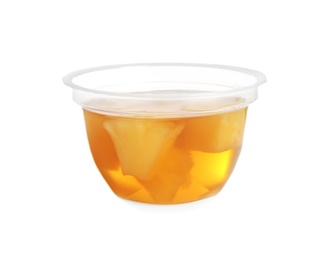 Photo of Plastic container with tasty pineapple jelly on white background