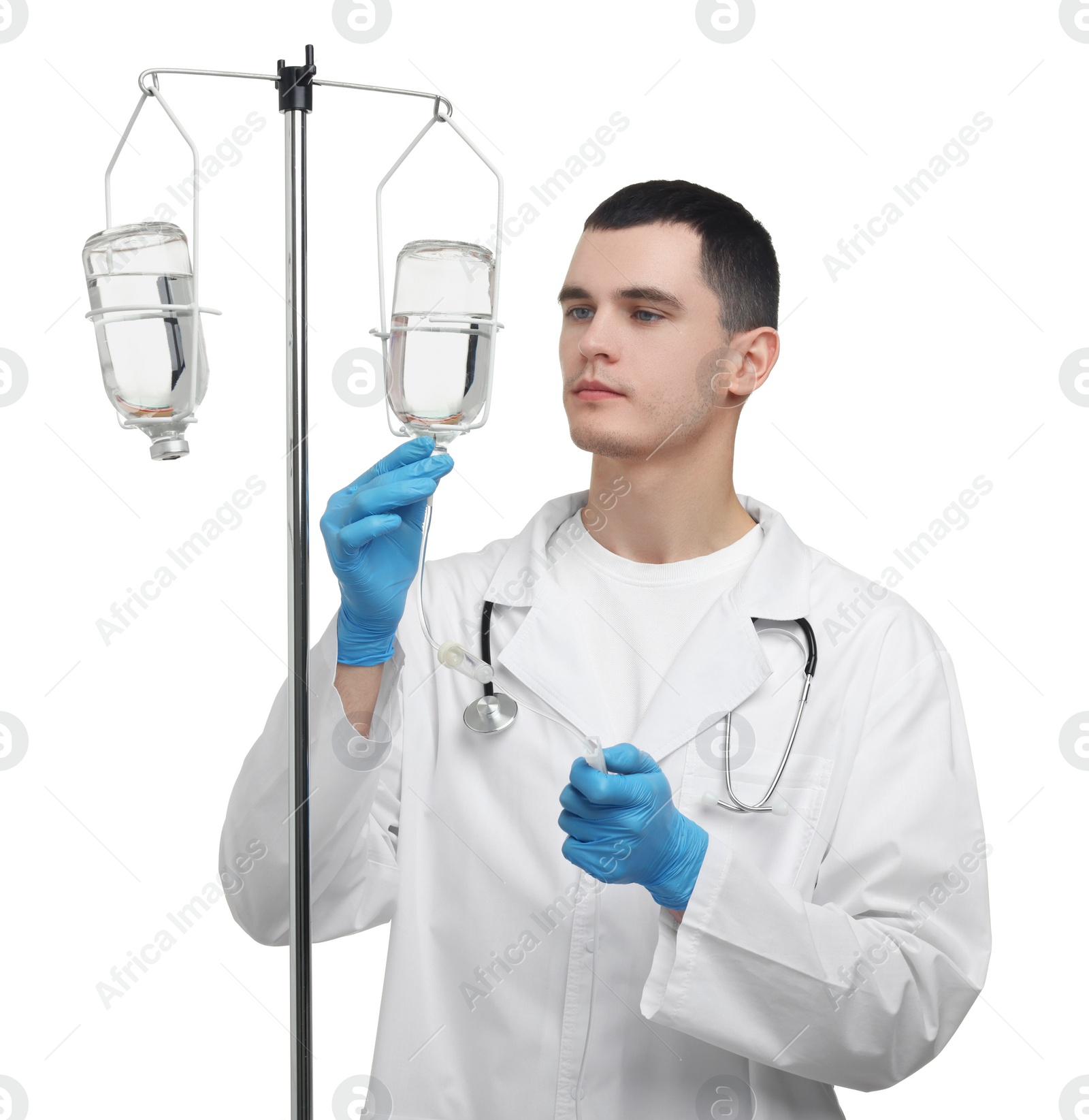 Photo of Doctor setting up IV drip on white background