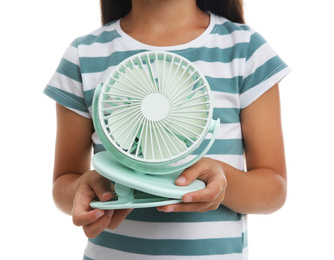 Photo of Little girl with portable fan on white background, closeup. Summer heat