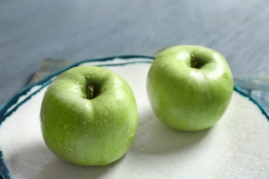 Photo of Plate with fresh green apples on table, closeup