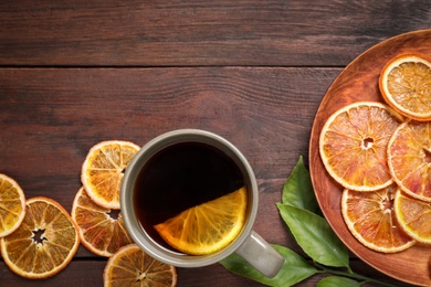 Photo of Composition with cup of mulled wine on wooden table, flat lay. Space for text