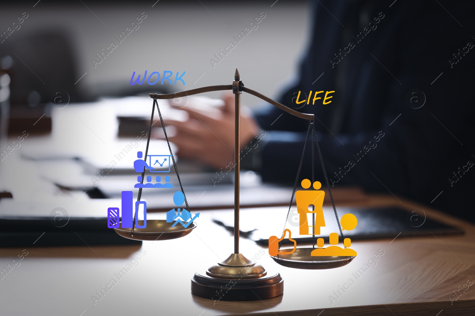 Image of Work-life balance concept. Scale with images on table