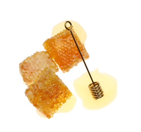 Photo of Fresh honeycombs and dipper on white background, top view