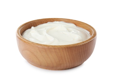 Photo of Bowl with sour cream on white background