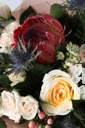 Photo of Beautiful bouquet with roses as background, closeup