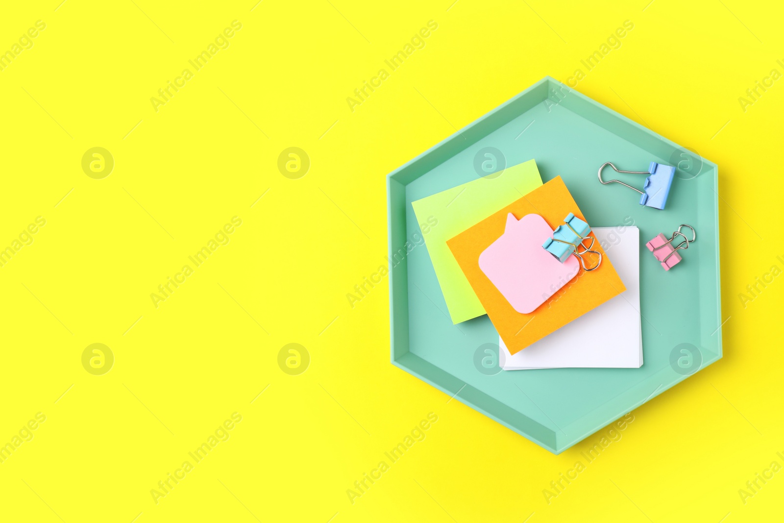 Photo of Stylish tray with office stationery on color background. Space for text