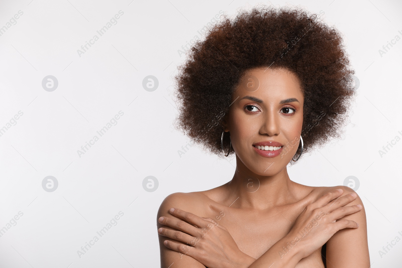 Photo of Portrait of beautiful young woman with glamorous makeup on white background. Space for text