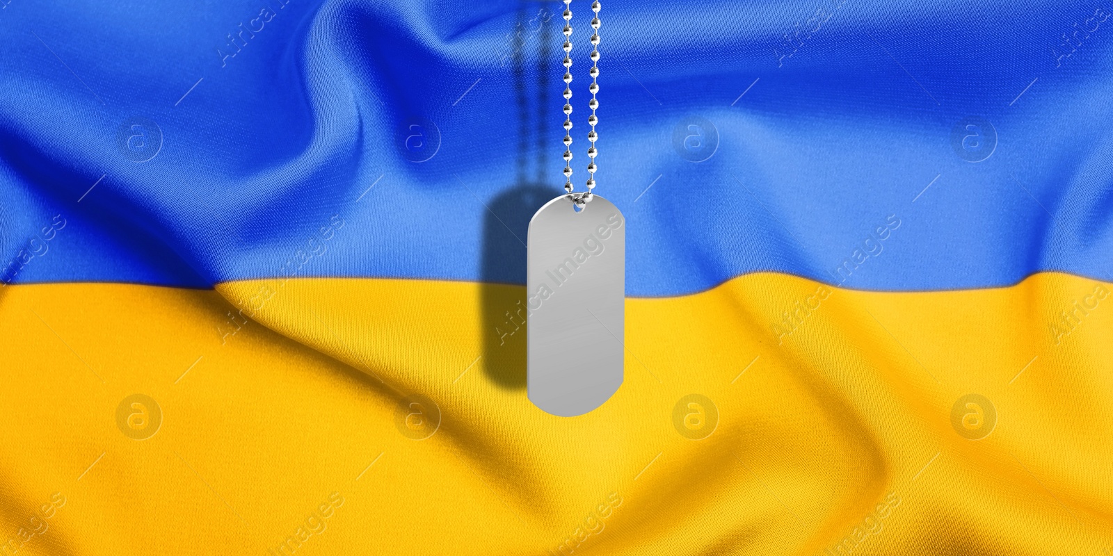 Image of Military ID tag and Ukrainian flag on background. Banner design