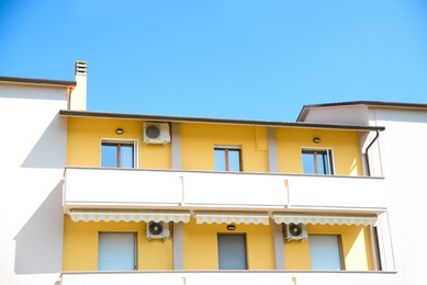 Photo of Beautiful house with large balcony against blue sky