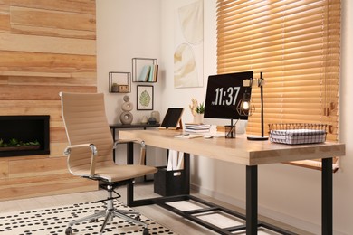 Photo of Room interior with comfortable workplace. Modern computer on wooden desk