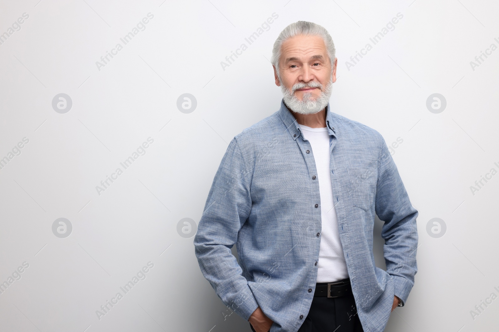 Photo of Portrait of handsome senior man on white background. Space for text