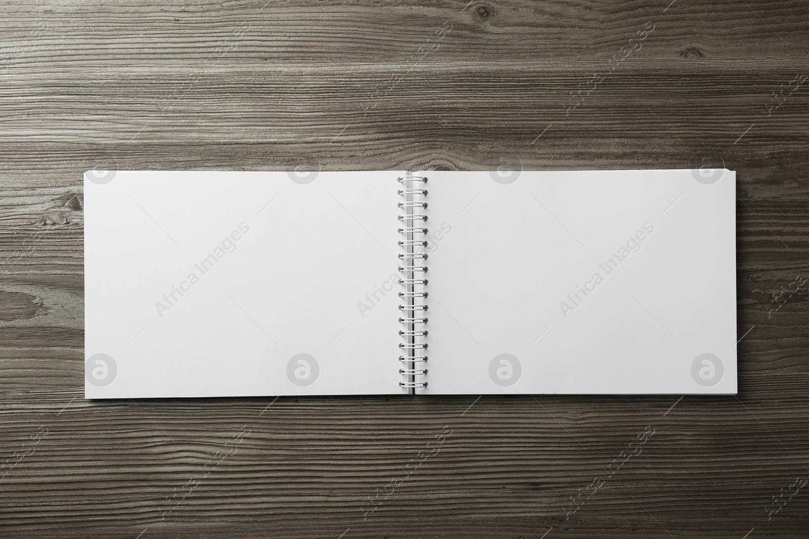 Photo of Blank paper brochure on wooden table, top view. Mockup for design