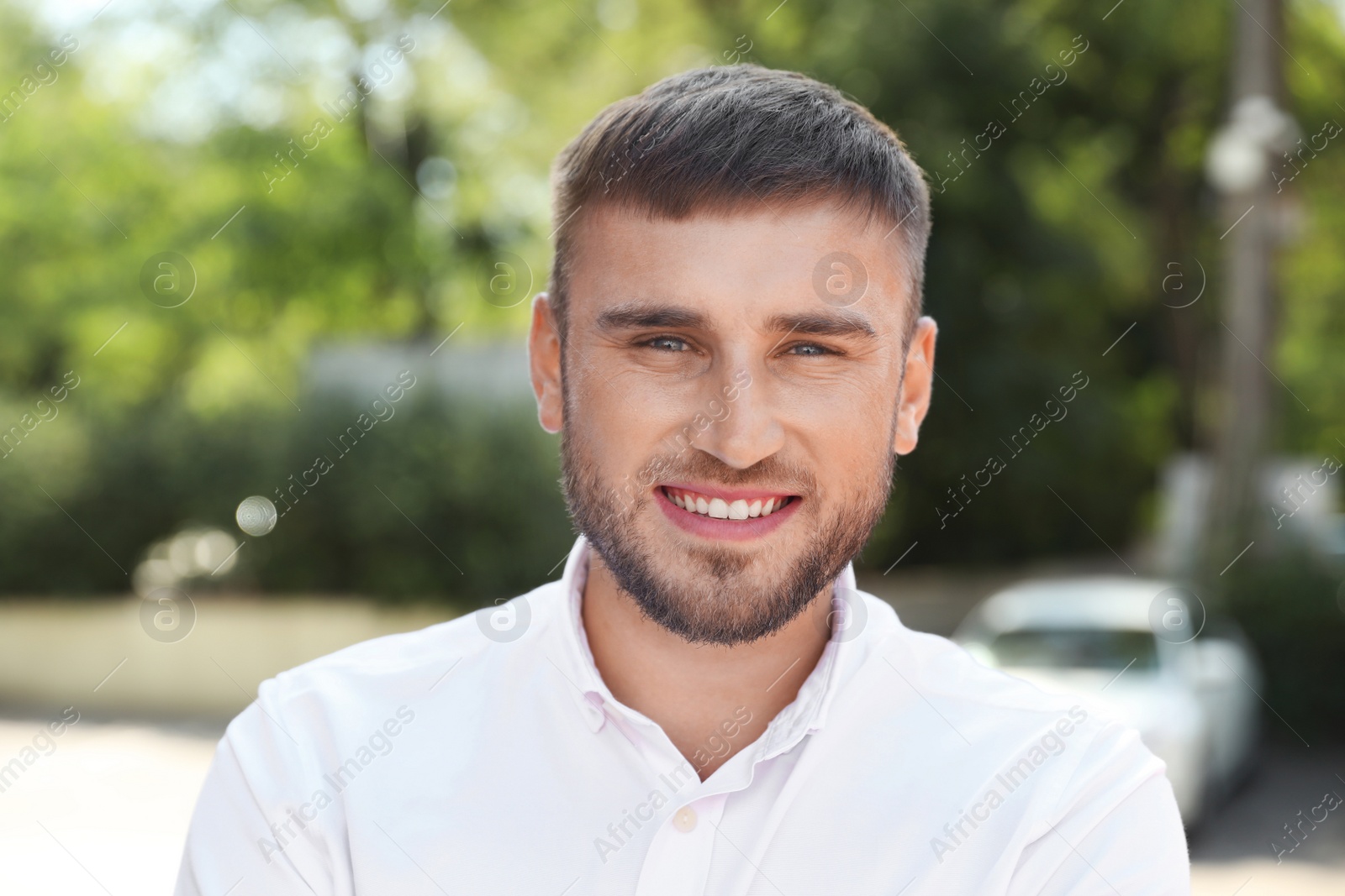 Photo of Portrait of handsome young man on street