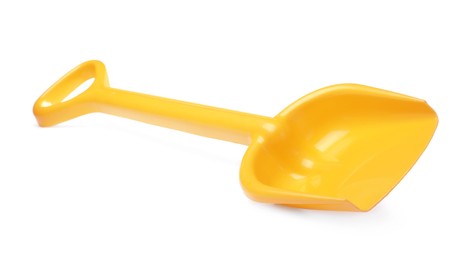 Yellow plastic toy shovel isolated on white