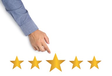Image of Quality evaluation. Businessman pointing at virtual golden stars on white background, closeup