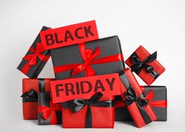 Many gift boxes and words Black Friday on white background