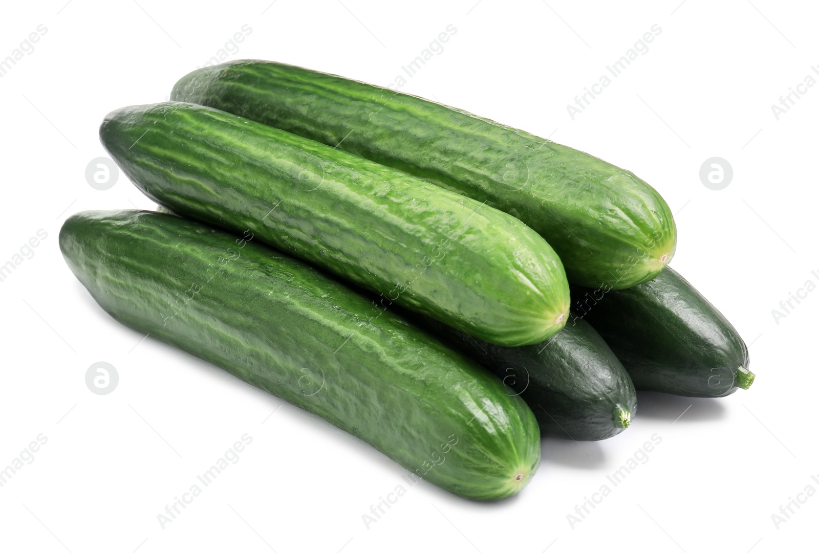 Photo of Many long fresh cucumbers isolated on white