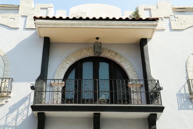 Photo of Exterior of building with beautiful window and balcony