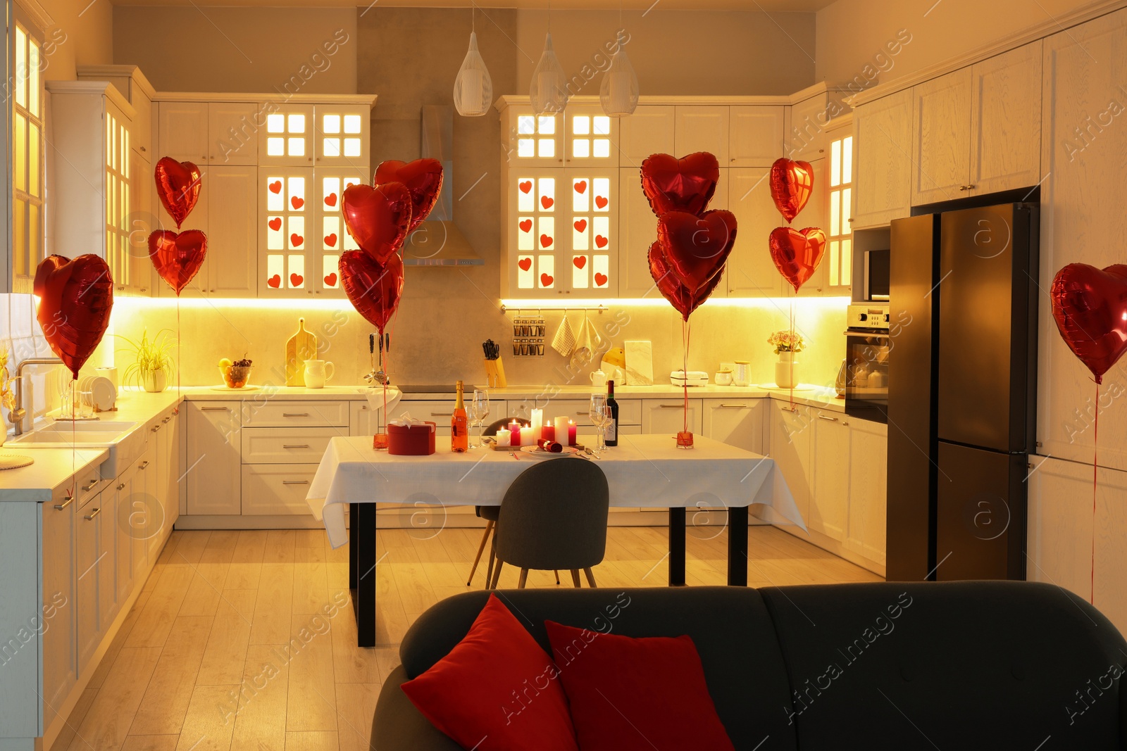 Photo of Romantic atmosphere. Cosy kitchen with set table decorated for Valentine day