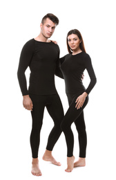 Couple wearing thermal underwear isolated on white