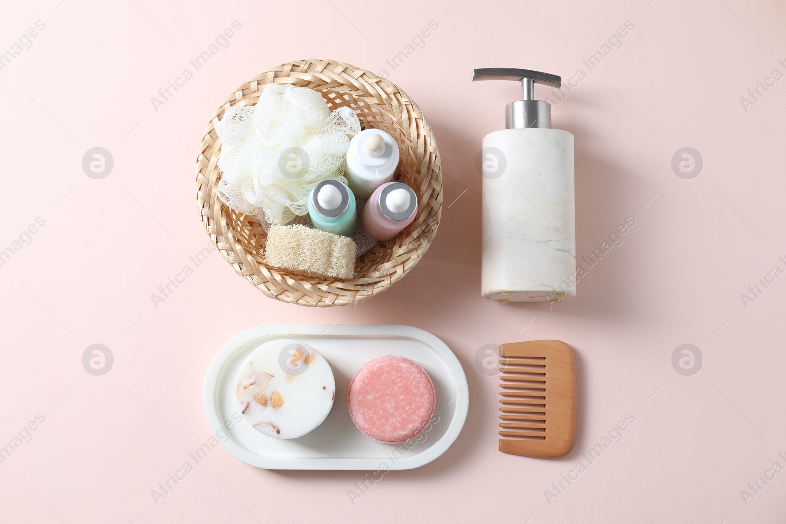 Photo of Bath accessories. Flat lay composition with personal care products on pink background