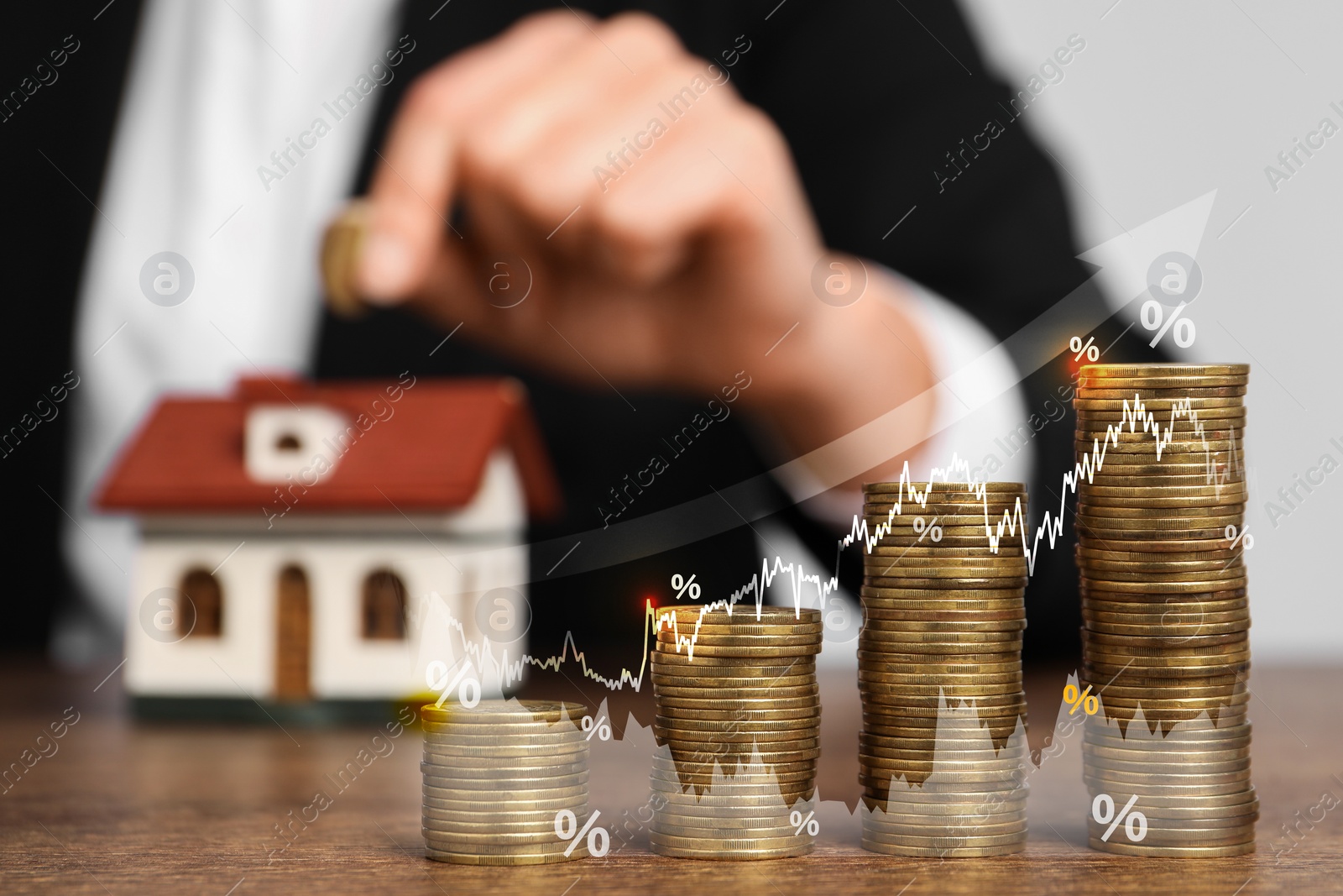 Image of Mortgage rate. Stacked coins, percent signs, arrow and graphs. Woman putting coin into house shaped money box, closeup