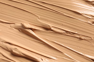 Photo of Texture of skin foundation as background, closeup