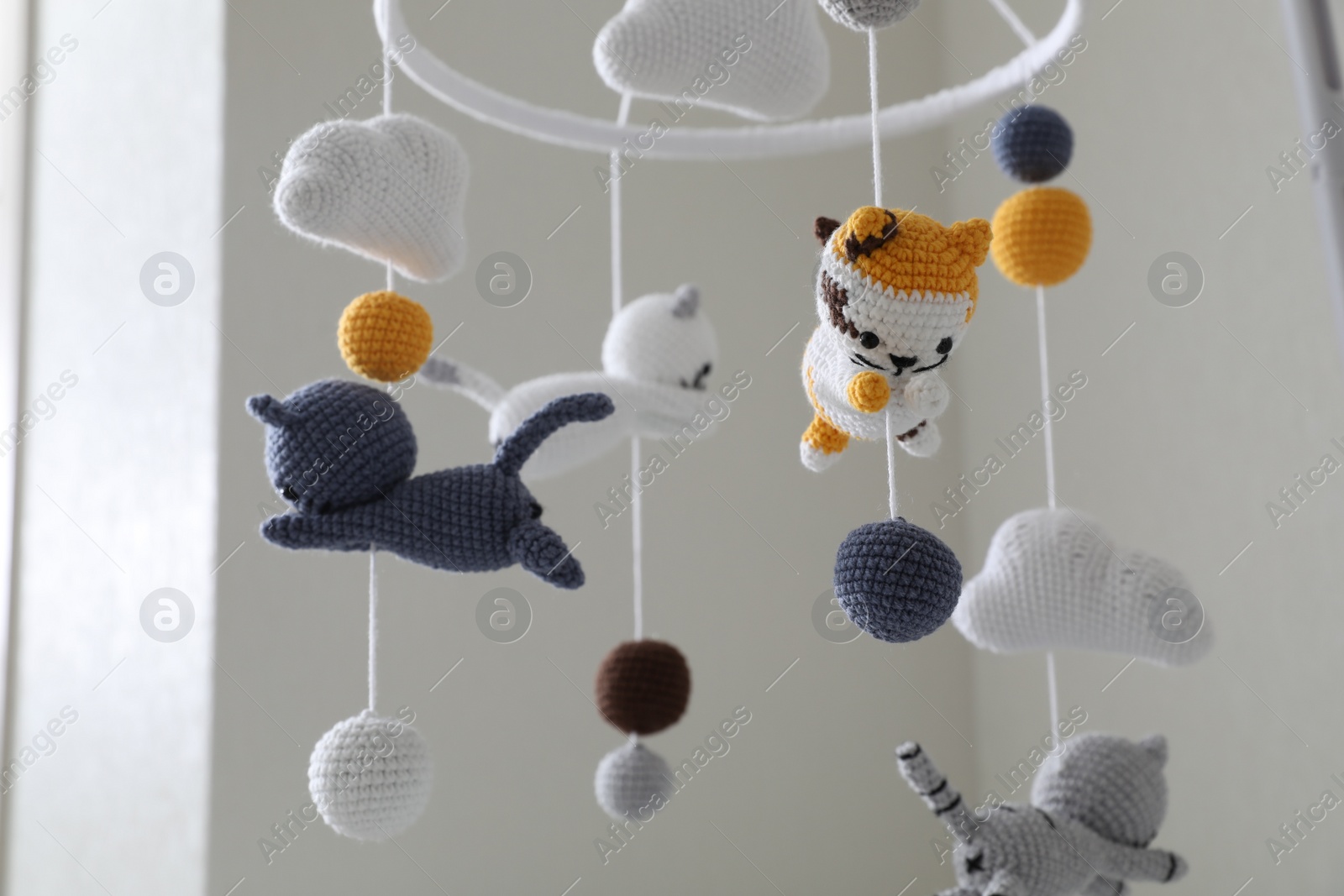 Modern baby crib mobile in children's room, closeup Photo of Modern baby crib mobile in children's room, closeup