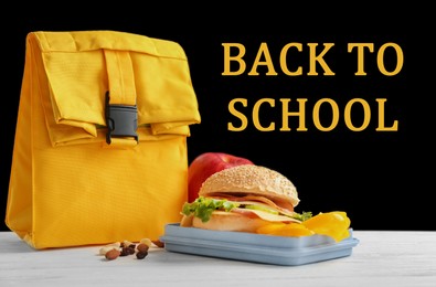 Image of Lunch box with appetizing food and bag on white wooden table near blackboard