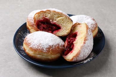 Delicious sweet buns with cherries on gray table, closeup