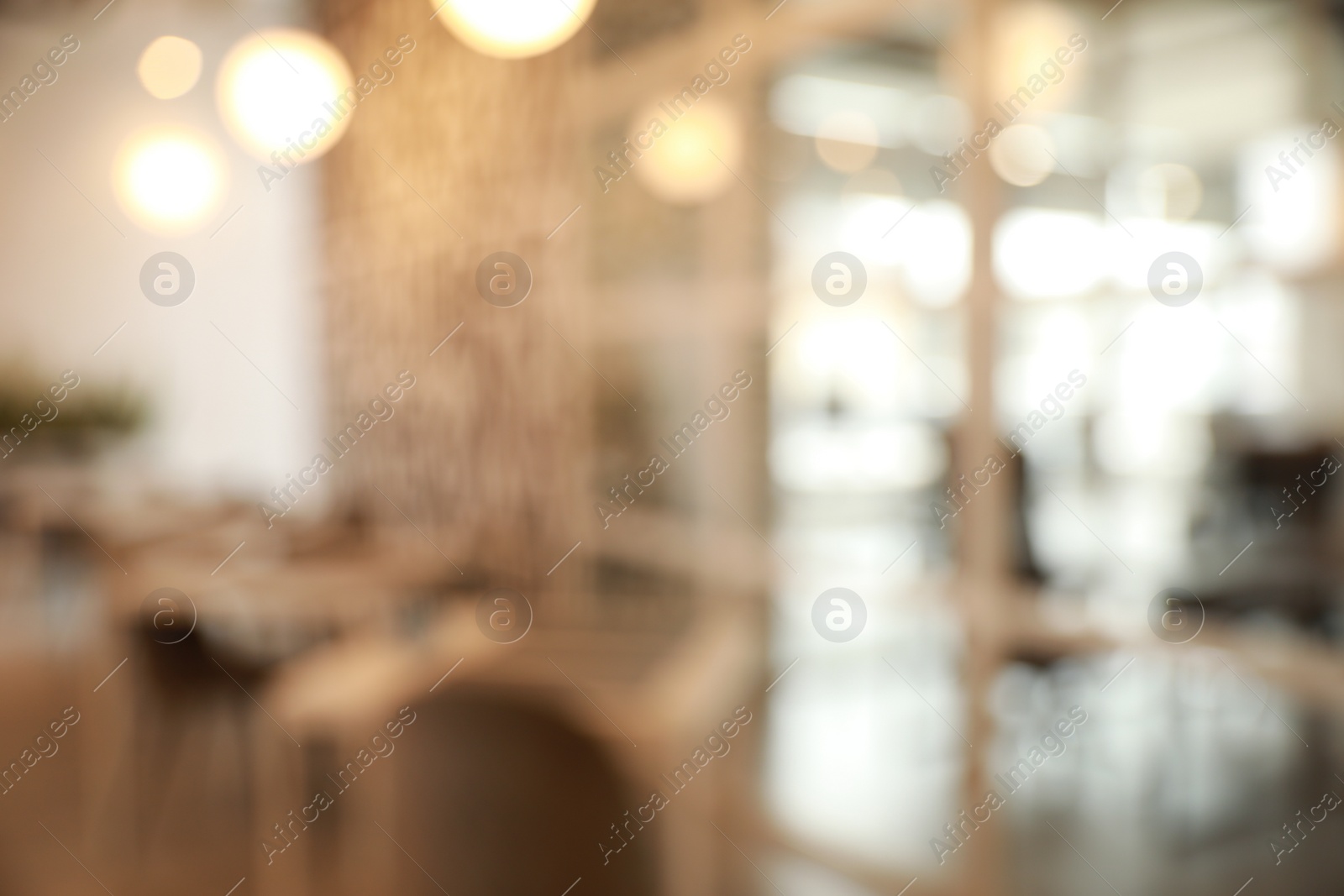 Photo of Blurred view of beautiful modern cafe interior