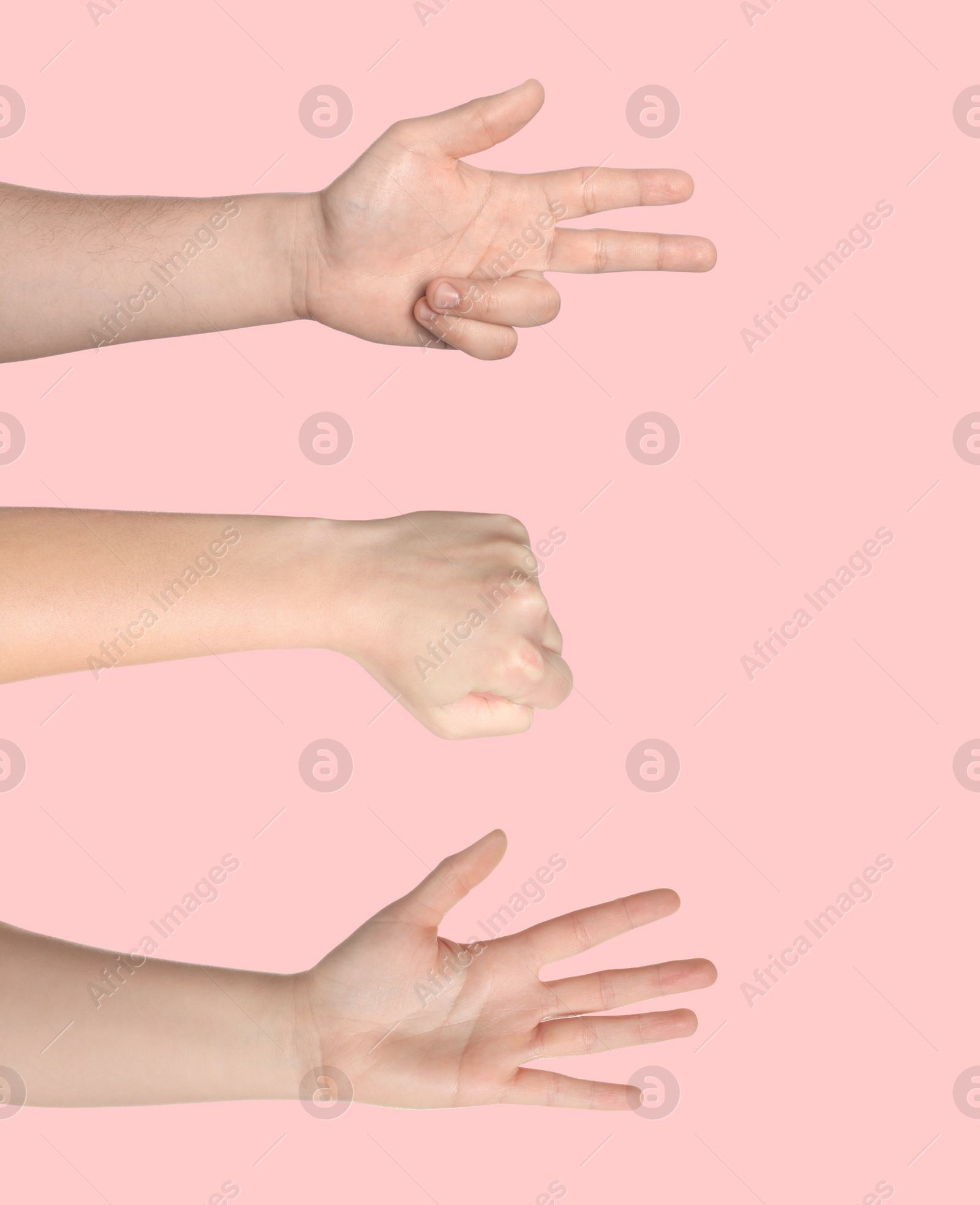 Image of People playing rock, paper and scissors on pink background, closeup