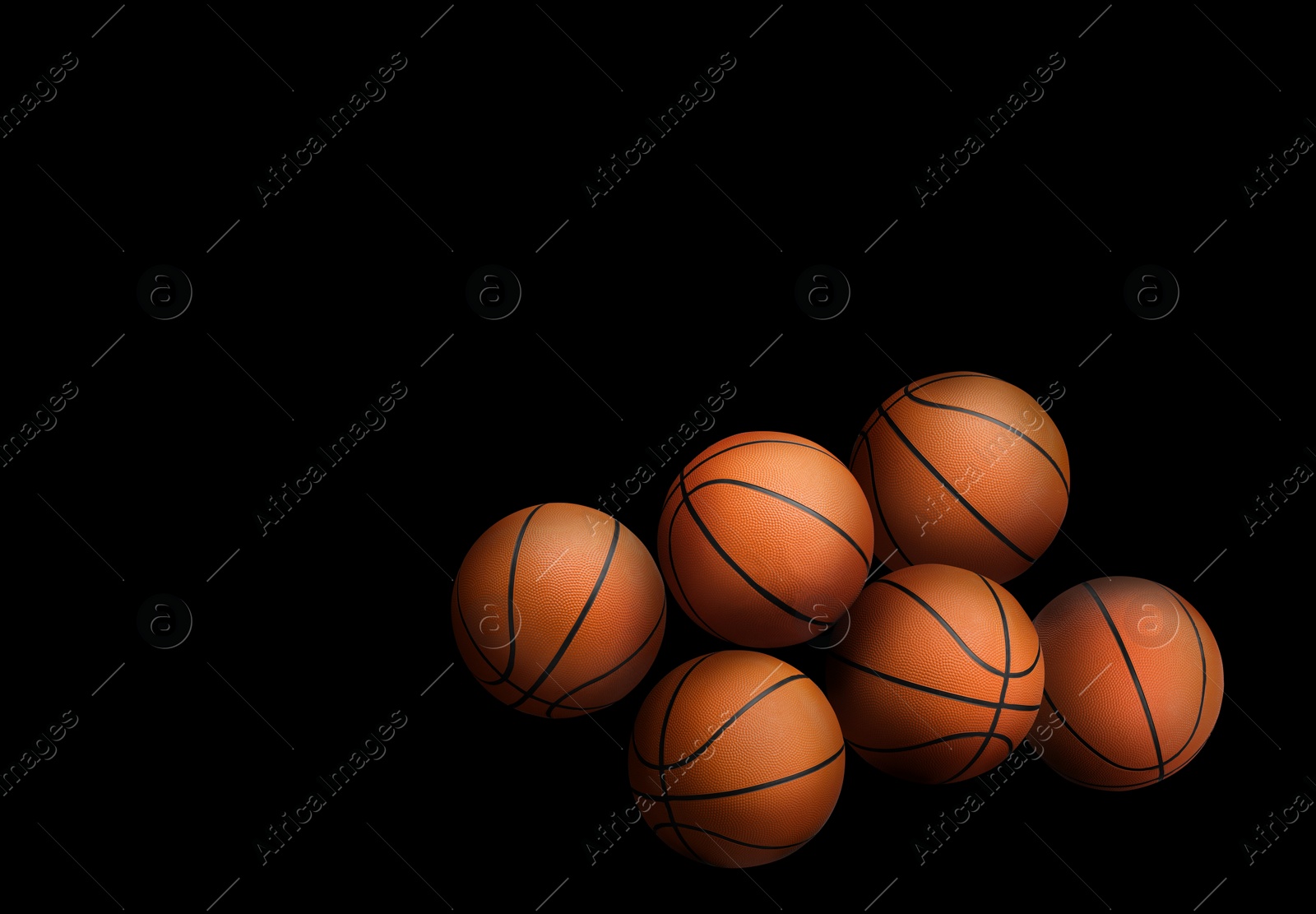 Image of Many orange basketball balls on black background