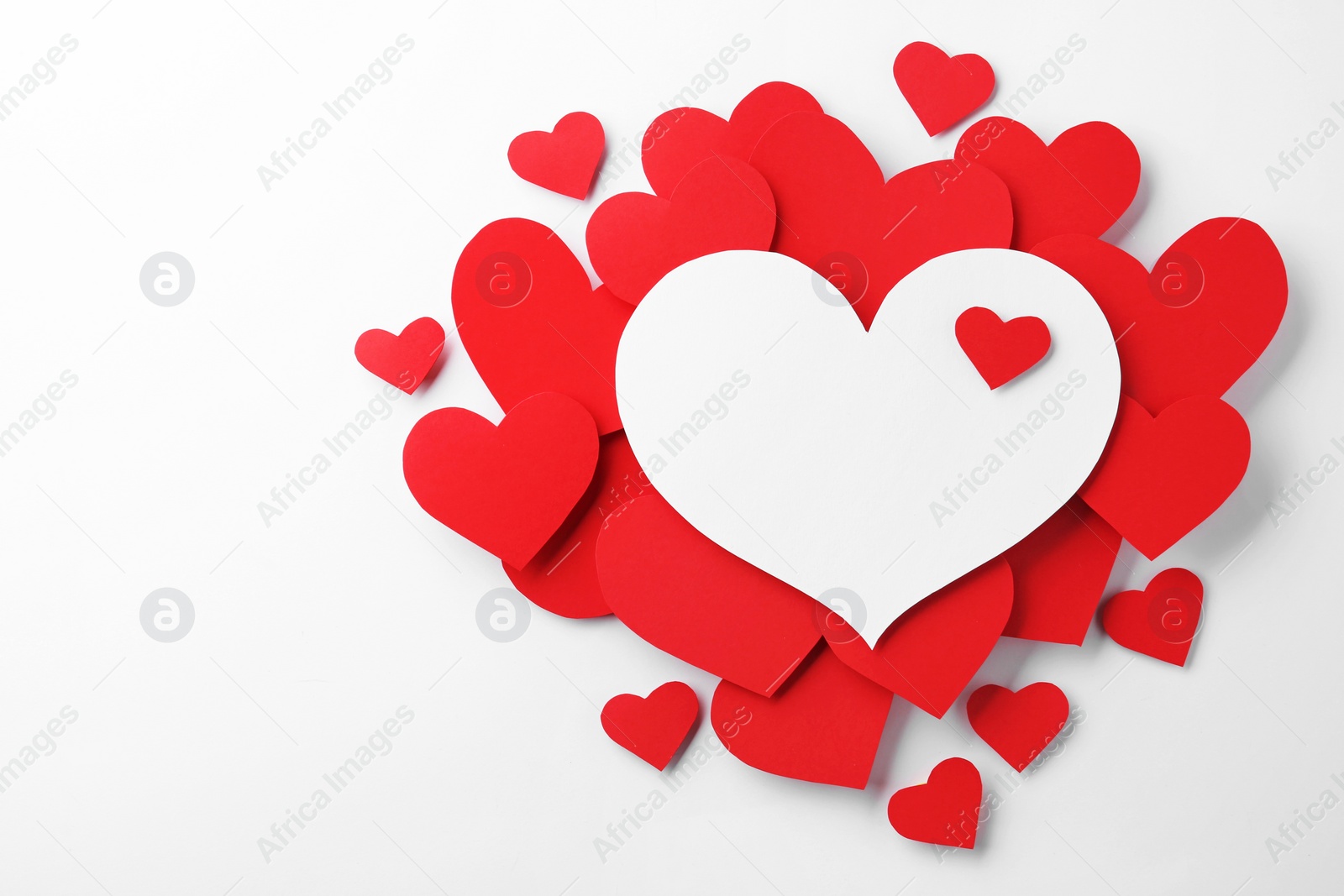 Photo of Composition with red hearts on white background, top view