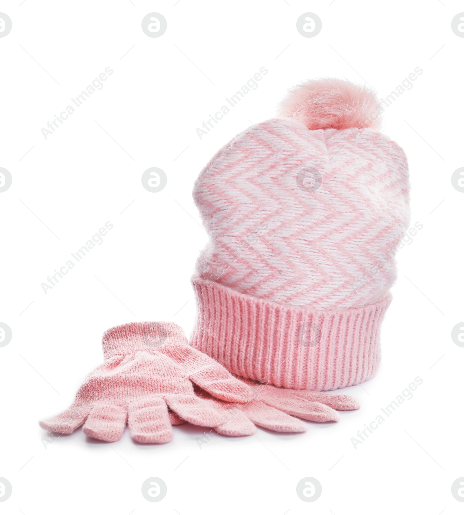 Photo of Pink woolen gloves and hat on white background. Winter clothes