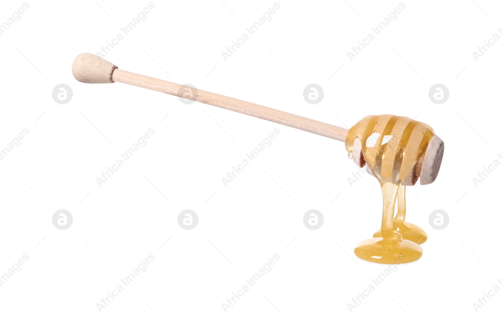 Photo of Natural honey dripping from dipper on white background