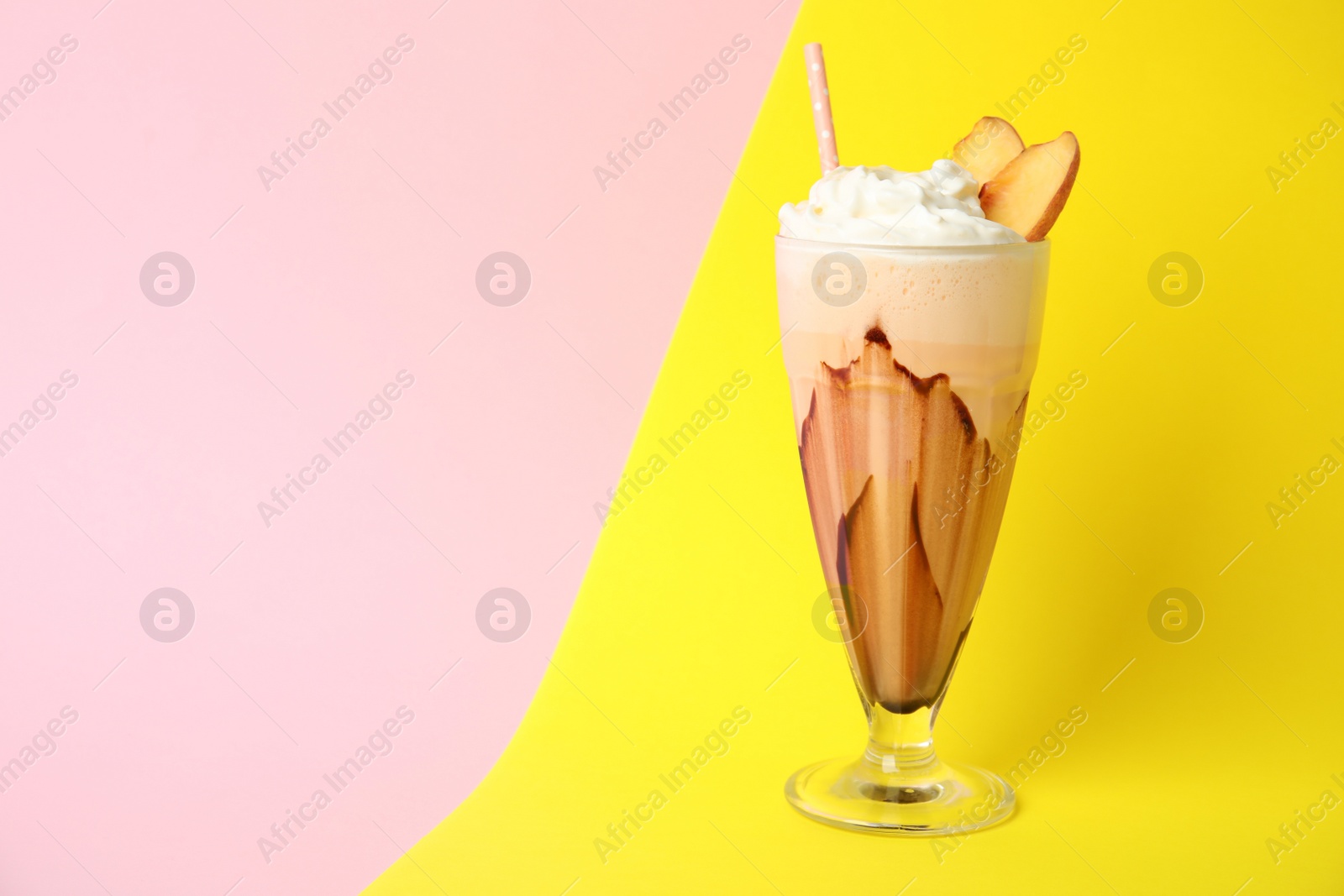 Photo of Glass of tasty milk shake and space for text on color background