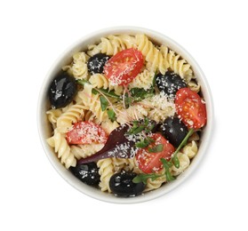 Bowl of delicious pasta with tomatoes, olives and cheese on white background, top view