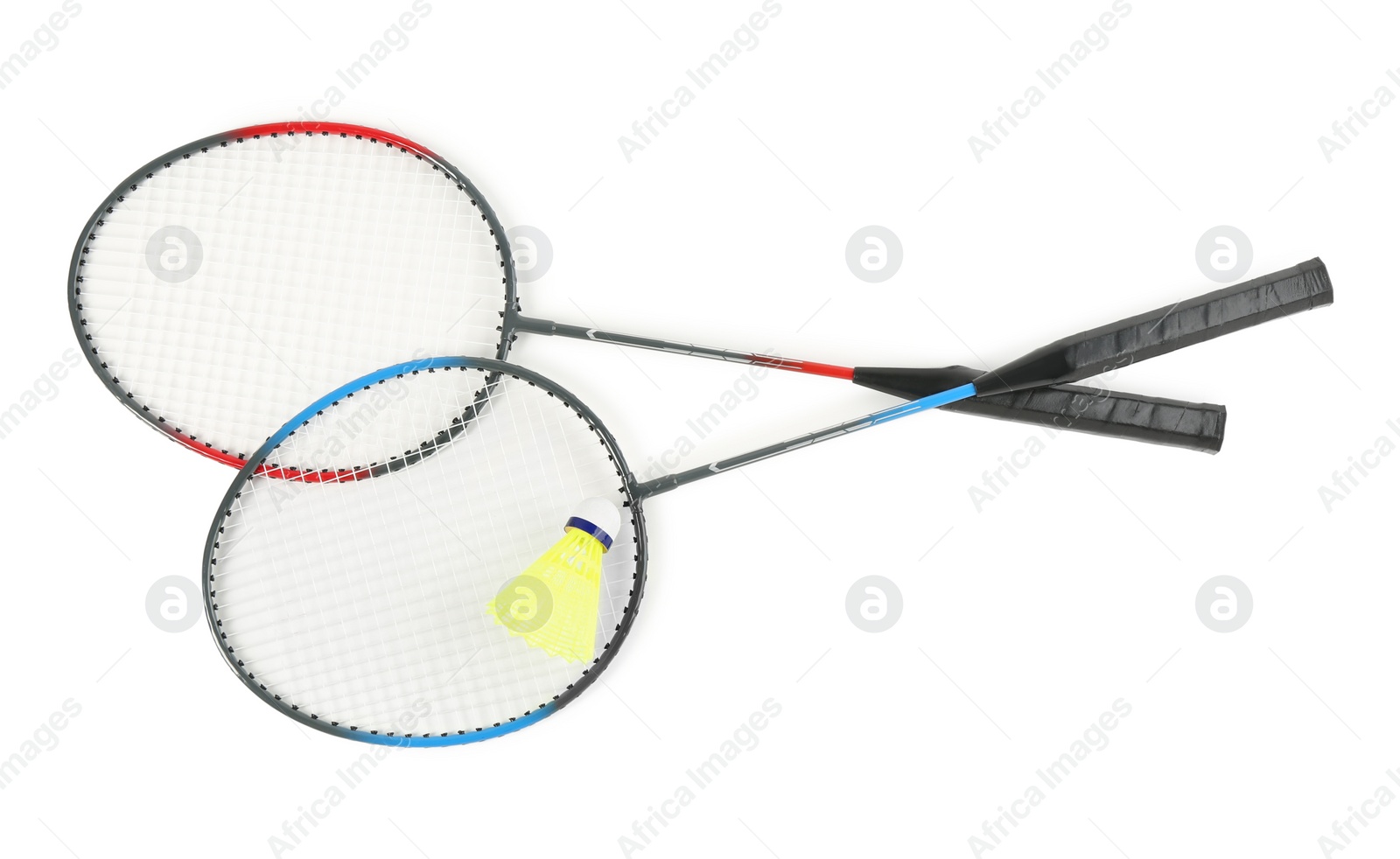 Photo of Rackets and shuttlecock on white background, top view. Badminton equipment