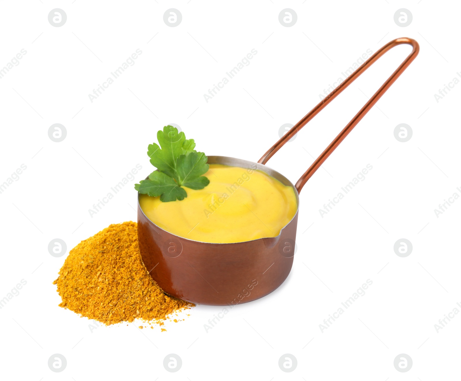 Photo of Saucepan with tasty curry sauce, powder and parsley isolated on white