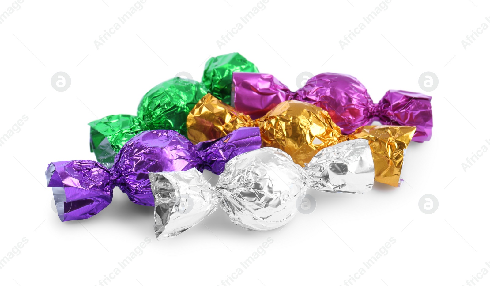 Photo of Tasty candies in colorful wrappers isolated on white