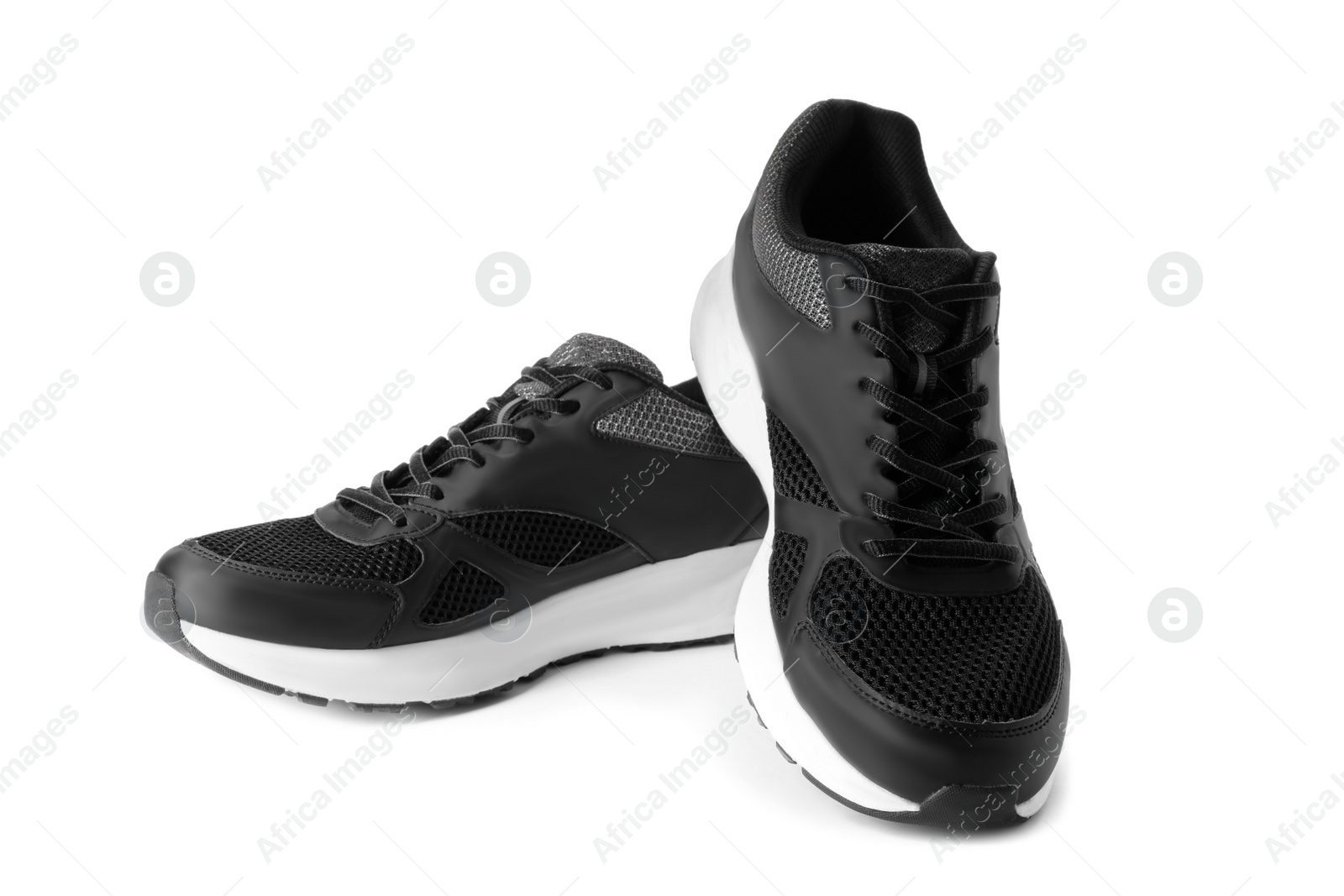 Photo of Stylish sport shoes on white background. Trendy footwear