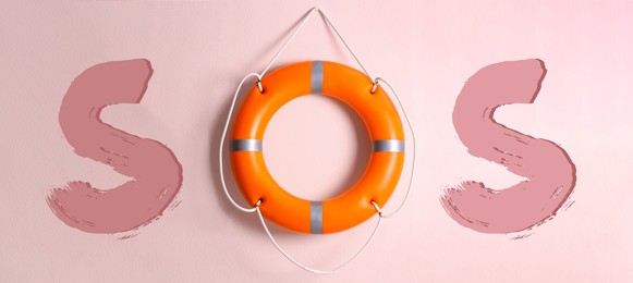 SOS message made from lifebuoy and letters on pink background. Banner design